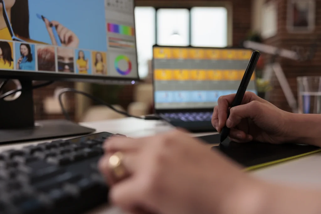 Designer working on vehicle wrap graphics on a tablet