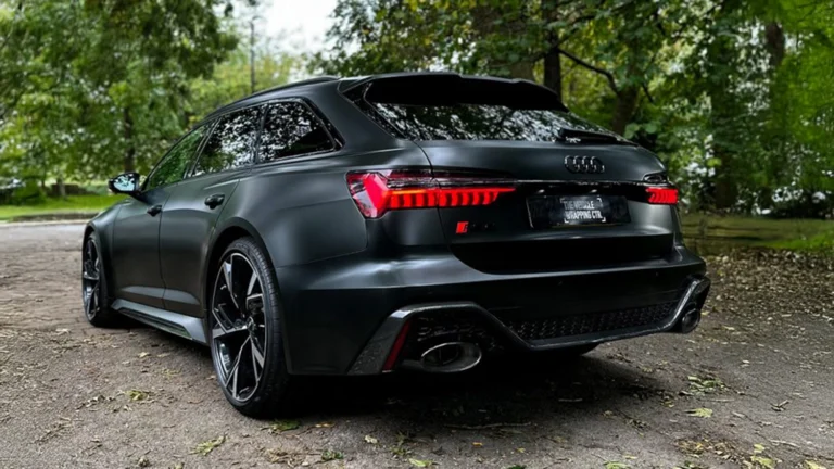 Audi estate wrapped in sleek matte black with professional window tinting. Premium car wrapping services, including paint protection film (PPF), custom graphics, colour change wraps, and wrap removals.