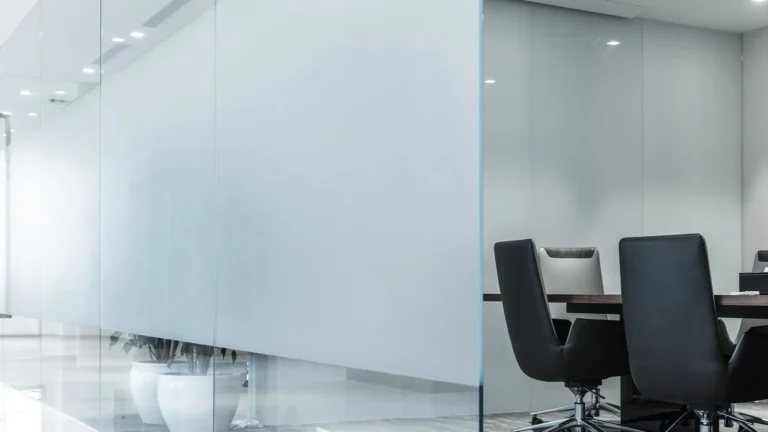 Frosted window film applied to a glass conference room partition for enhanced privacy and modern aesthetics.