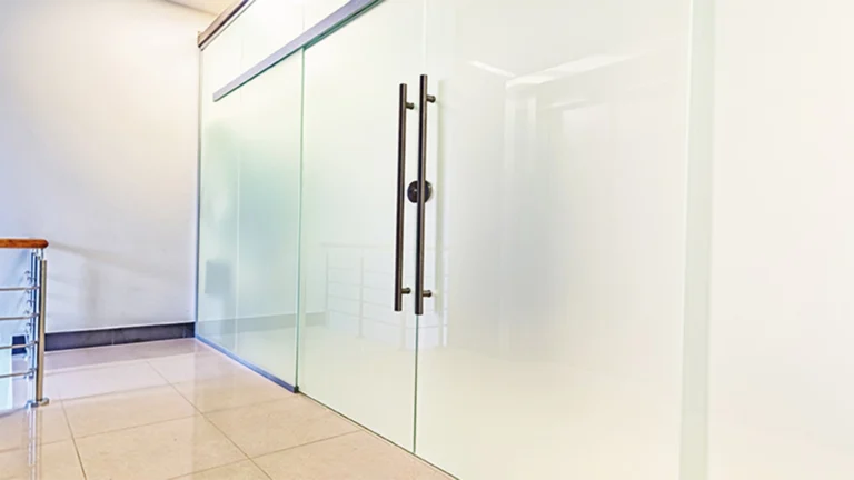 Full-coverage frosted glass window film applied to office glass doors for enhanced privacy and a sleek, modern design.