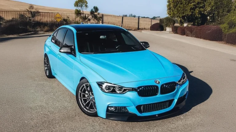 BMW 3 Series wrapped in a stunning gloss sky blue finish. Expert car wrapping with colour change, window tinting, custom graphics, and PPF protection.