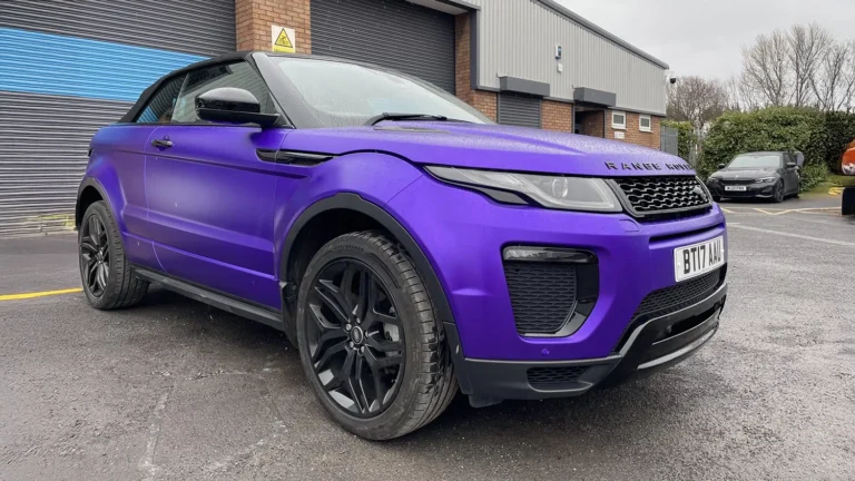 Range Rover wrapped in a bold matte purple finish, featuring a professional colour change. Expert car wrapping services including PPF protection, window tinting, custom graphics, and wrap removals.