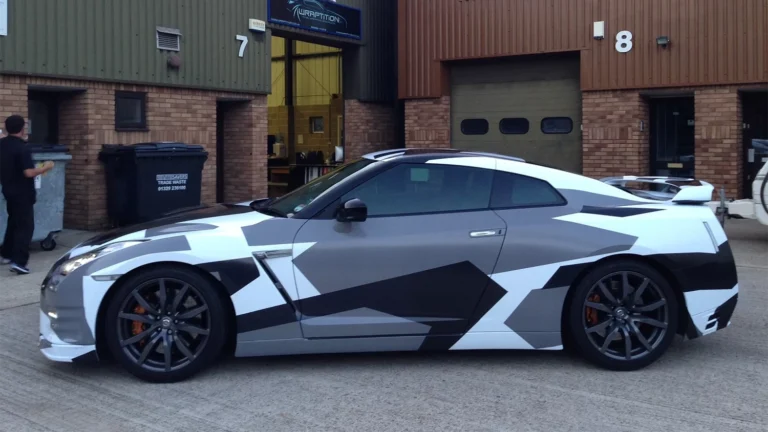 Nissan GT-R wrapped in a stylish urban camouflage design. Professional car wrapping services including custom graphics, colour change wraps, PPF protection, and window tinting.