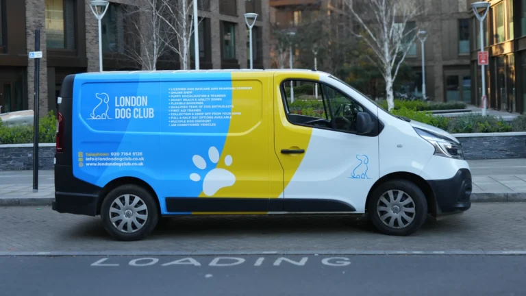 Side view of London Dog Club van wrap by a wrap company near me in London with blue, yellow and white branding