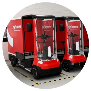 Branded red cargo bikes wrapped by WrapMates for JoyExpress, featuring clean vehicle graphics and logo application.