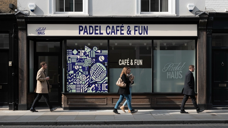 Storefront for 'PADEL CAFÉ & FUN' and 'Padel HAUS,' featuring an intricate, modern, geometric design in white and blue.