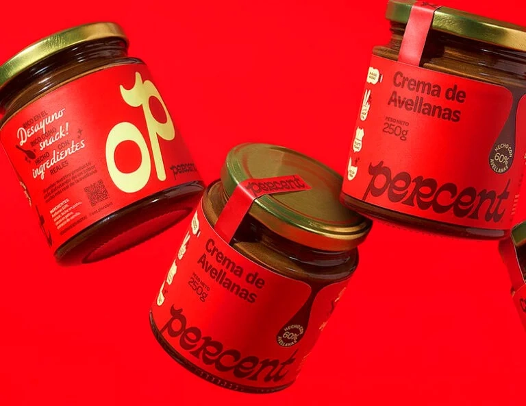 Three glass jars of "Crema de Avellanas" with vibrant red wrap-around labels and matching tamper-evident lid seals.