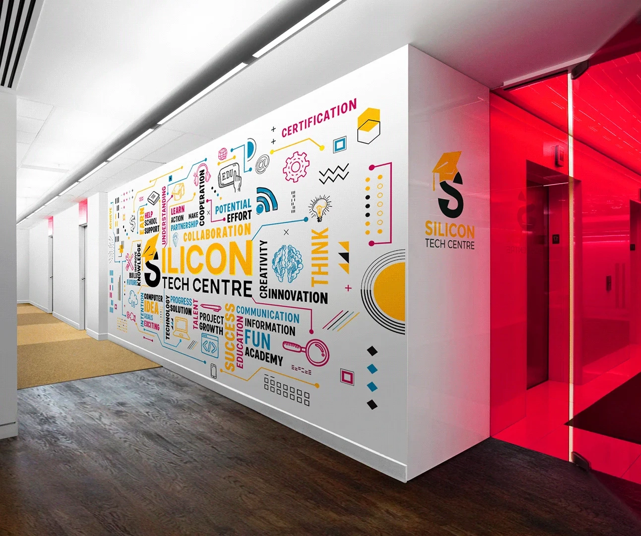 A white office wall featuring a colorful typographic and icon-based mural for 'SILICON TECH CENTRE' next to a bright red glass entryway.